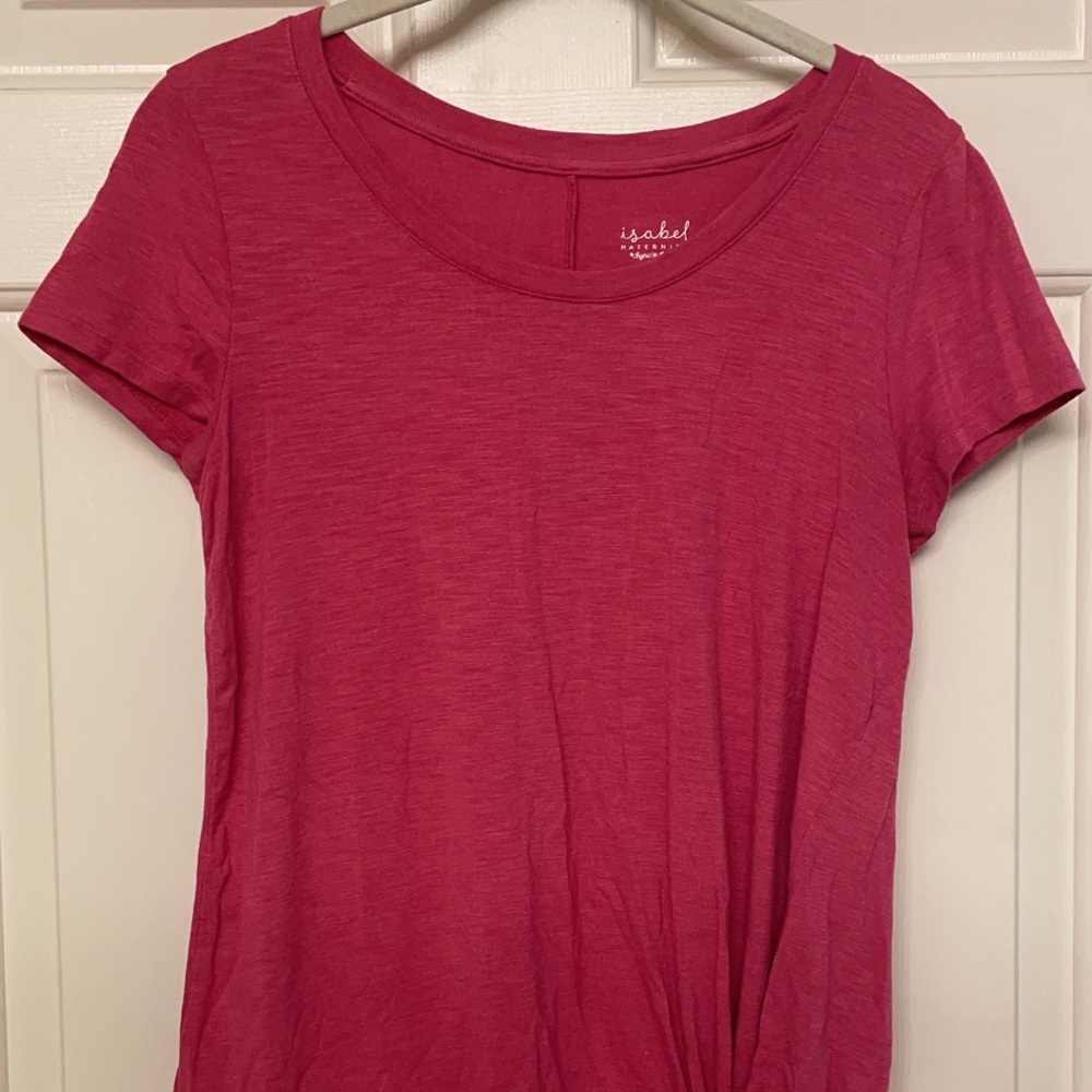 Pink shirt with ruffled design on the bottom